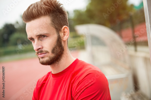 Running coach! Portrait of a coach on a track.