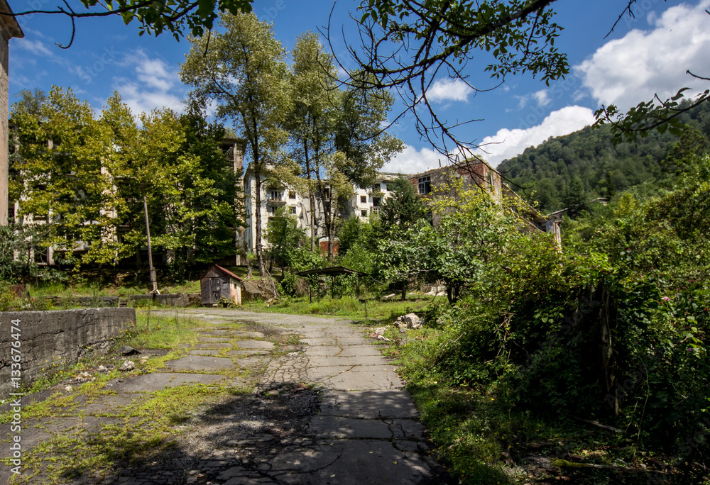 Abandoned mining ghost-town Polyana, Abkhazia. Destroyed empty houses 