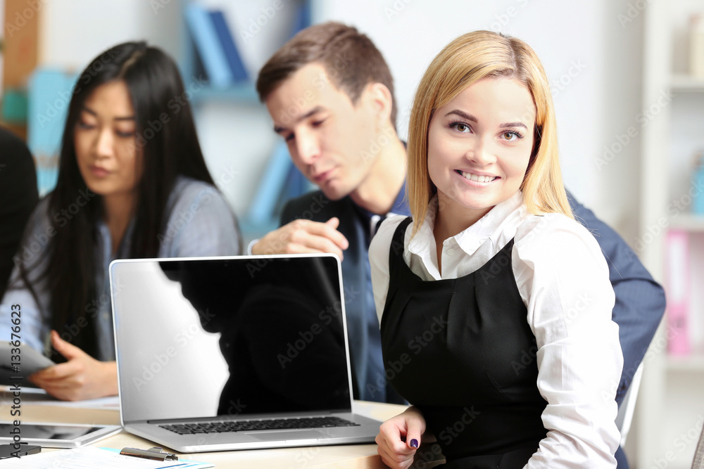 Businesswoman with colleagues in conference room Businesswoman with colleagues in conference room