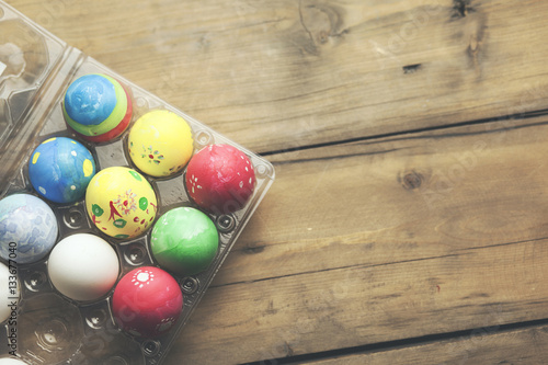 Painted Easter eggs lie in rows
