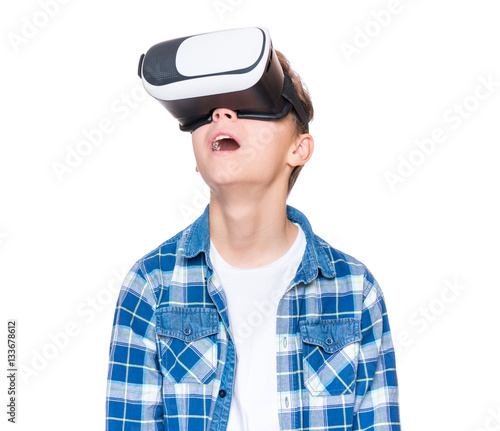 Teen boy in VR glasses © valiza14