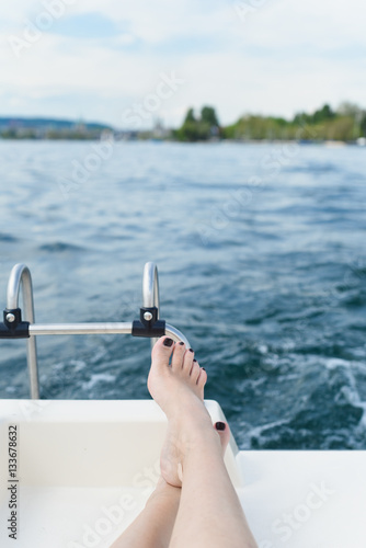 Picture of female feet on a yacht on a lake in Switzerland © Корнеевец-Выдренкова
