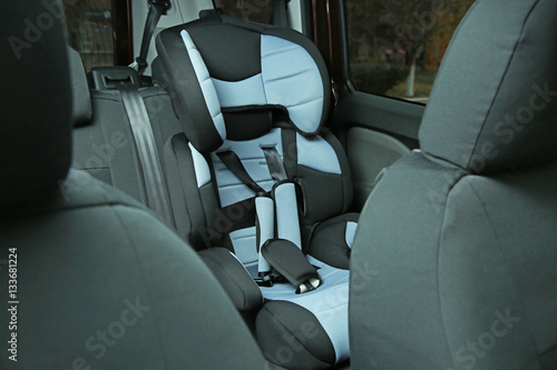 Empty safety seat for baby in car © Africa Studio