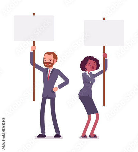 Man and woman holding picket signs, copy space
