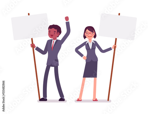 Man and woman with standing picket signs, copy space