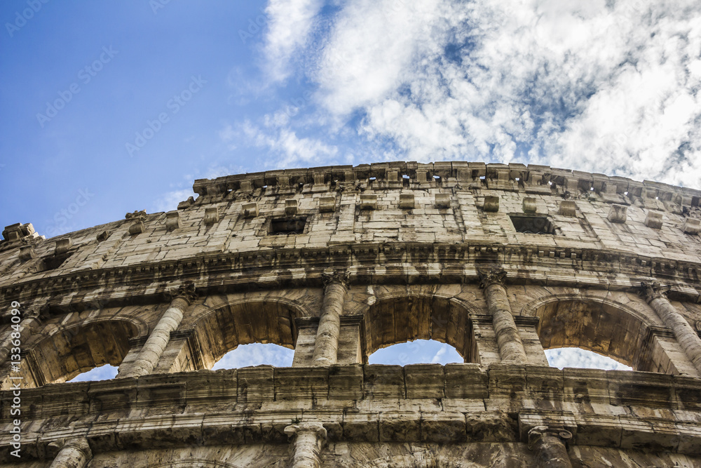 Close-up view of ancient archs of the Roman Coliseum in Rome Italy