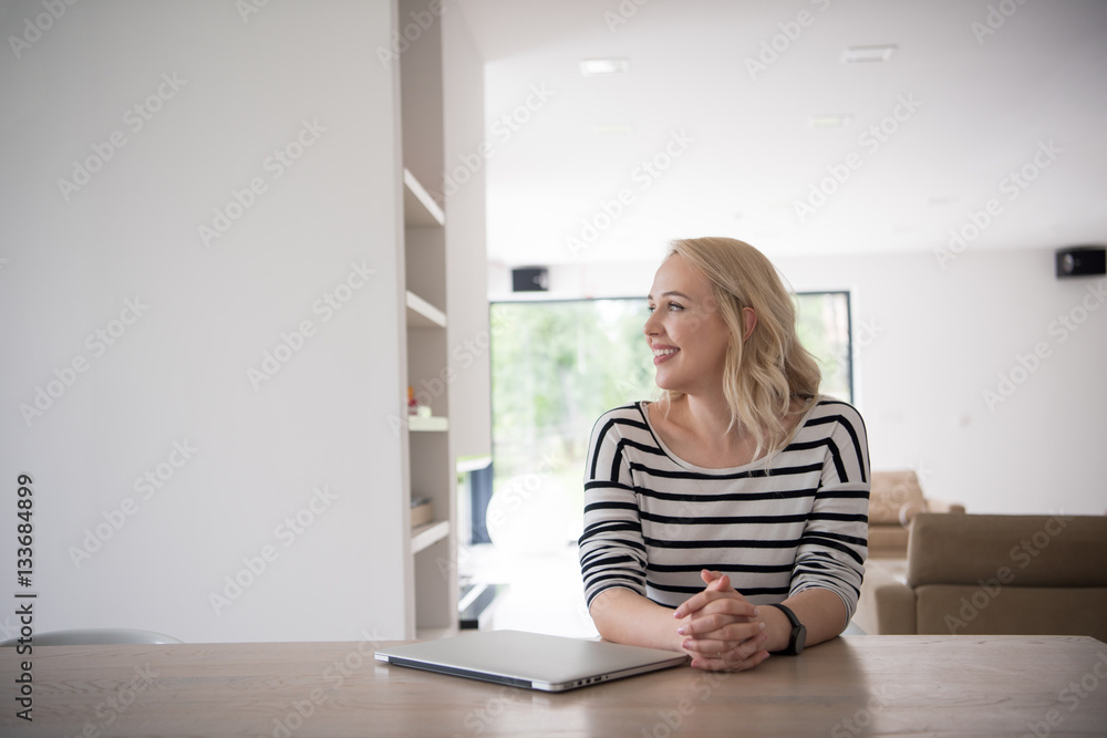Young woman with laptop at home Young woman with laptop at home