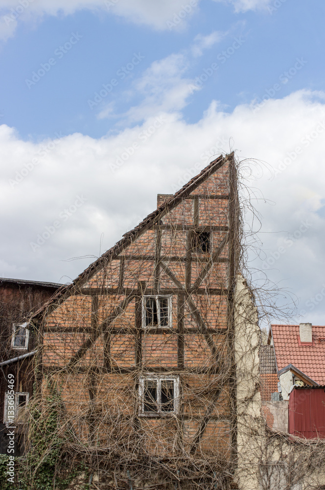 Fototapeta premium half-timbered house / Old half-timbered house against a blue sky