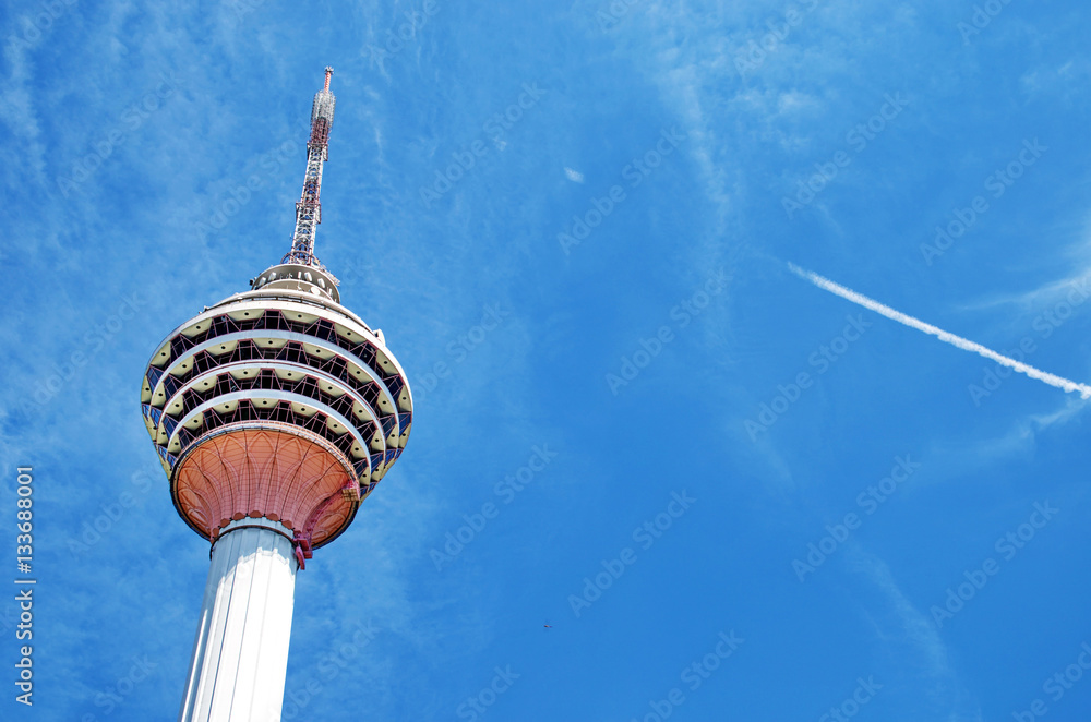 Naklejka premium Travel in Malaysia. Kuala Lumpur Tower (Menara) on May 18, 2013 in Kuala Lumpur, Malaysia. The tower reaches 421 m, which currently makes it the second tallest freestanding tower in the world