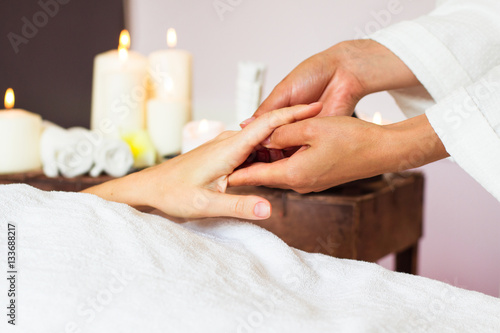 Woman receiving a hand massage at the health spa.