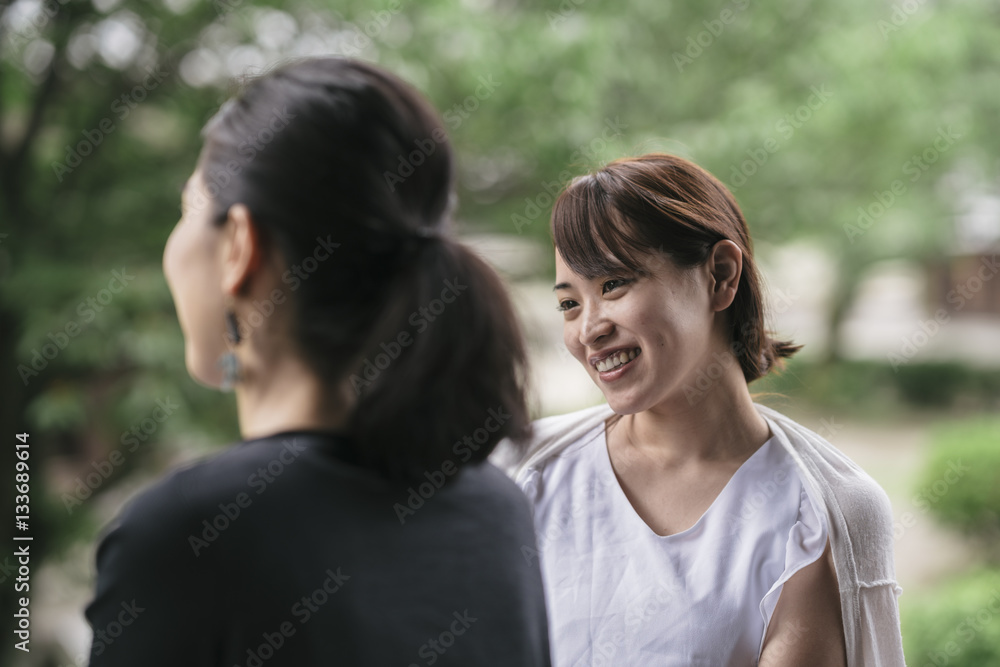 two young japanese woman talking two young japanese woman talking