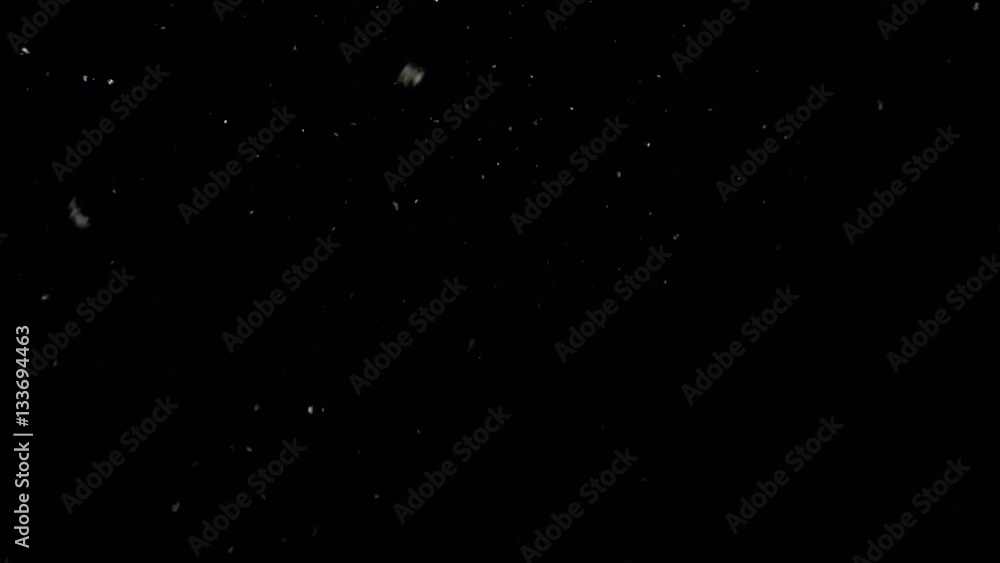 Falling snow on cold winter night. Snowflakes over black background. Falling snow on cold winter night. Snowflakes over black background.