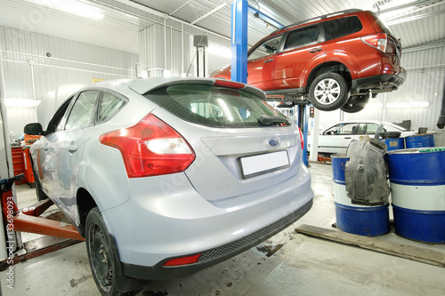 car on a lift in a car repair station