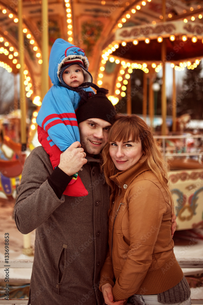 happy family with child posing outdoor