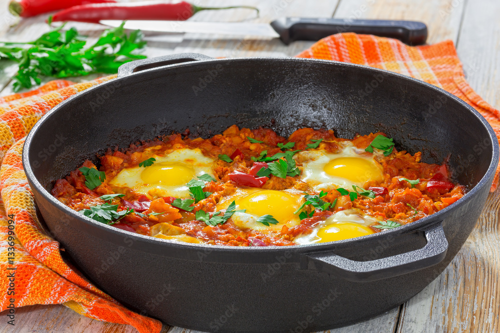 delicious middle east  shakshuka - fried eggs, onion, bell peppe