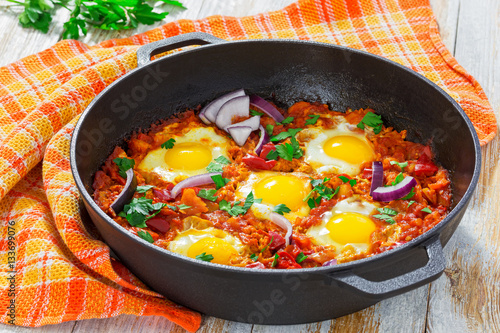  fried eggs, onion, bell pepper, tomatoes, chilli and spices
