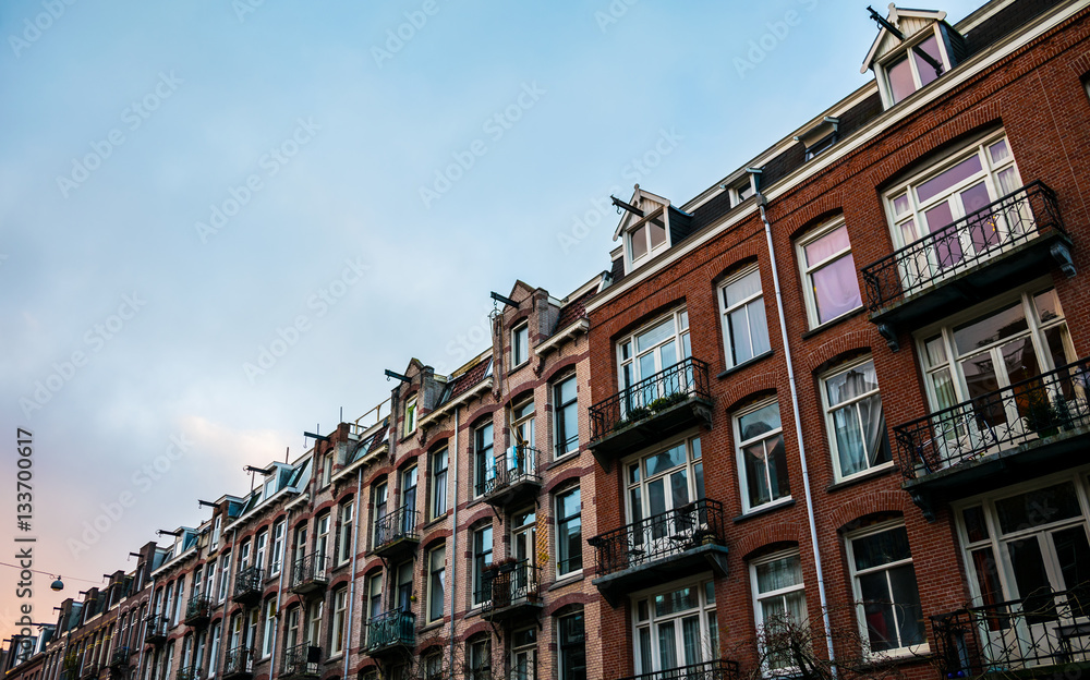 Amsterdam housefronts with blue sky