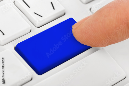 Computer notebook keyboard with blank blue key