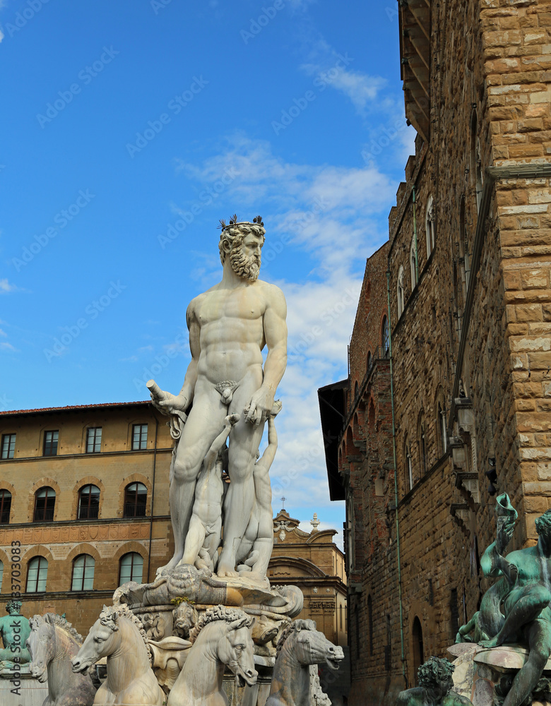 FLORENCE White statue of Neptune in the ancient fountain i