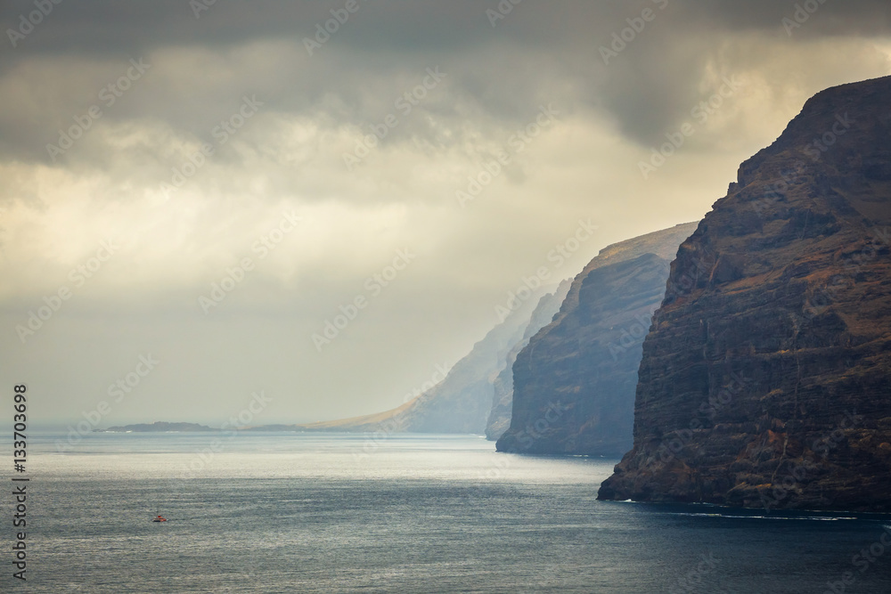view of the cloudy cliffs of Los Gigantes in Tenerife, Canary Islands, Spain