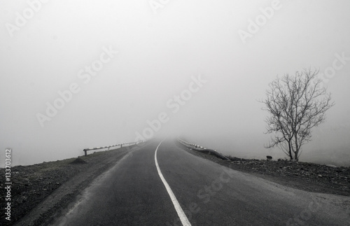 Foggy Country Road. Fog creates a feel of emptiness as it leads to seemingly nowhere. Ilisu, Gakh, Azerbaijan