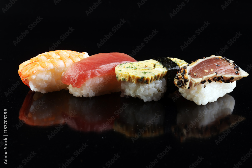close up of sashimi sushi set with chopsticks and soy - sushi roll with salmon and sushi roll with smoked eel, selective focus. close up of sashimi sushi set with chopsticks and soy - sushi roll with salmon and sushi roll with smoked eel, selective focus.