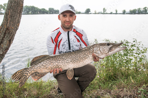 Fisherman with pike trophy