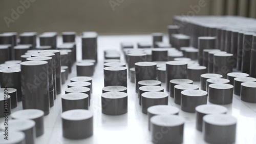 Factory. worker lays varistors on a special table. Slide photo