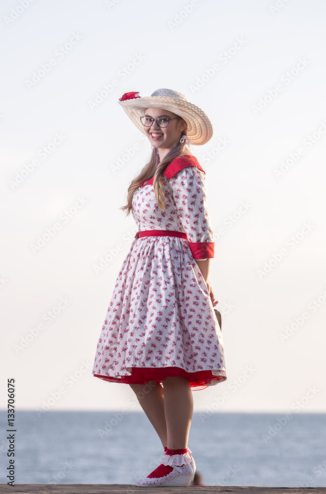 Cute pinup girl with red and white dress.