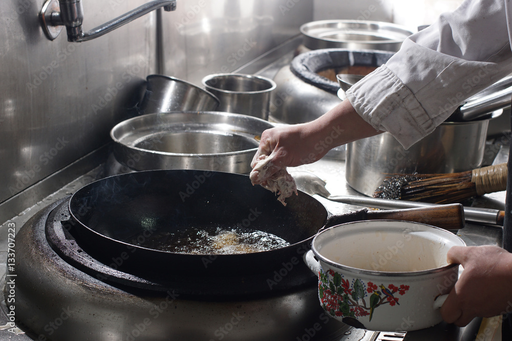 Close up of working chef preparing chinese food Close up of working chef preparing chinese food