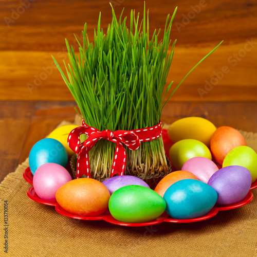 Colored eggs, wheat springs Nowruz Holiday in Azerbaijan. Selective focus.