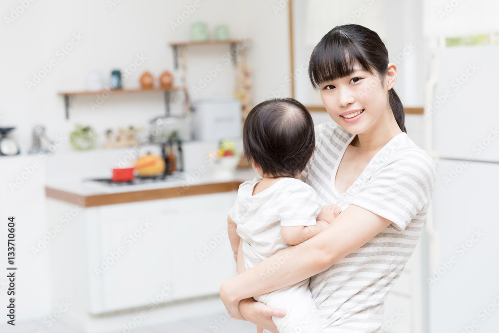 portrait of asian mother and baby in the kitchen portrait of asian mother and baby in the kitchen