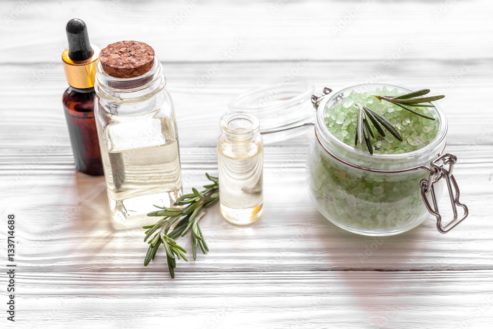 organic cosmetics with extracts of herbs rosemary on wooden background organic cosmetics with extracts of herbs rosemary on wooden background