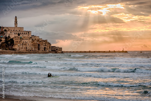 Valokuva Surfers at Sunset - Jaffa, near Tel Aviv, Israel - Mediterranean