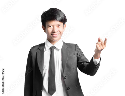 Portrait of a handsome businessman pointed the finger to right s photo