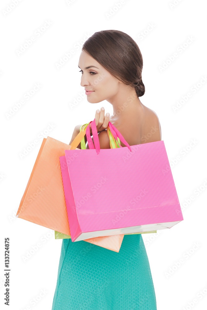 Beauty woman smiling while carrying shopping bags Beauty woman smiling while carrying shopping bags