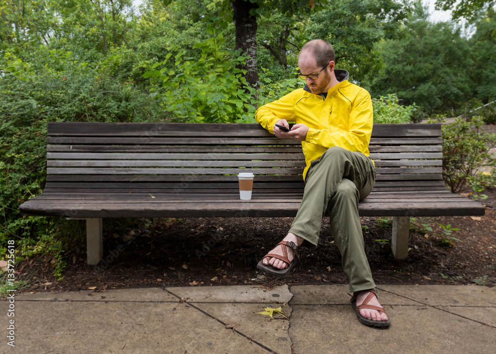 Obraz premium Man Sitting on Park Bench