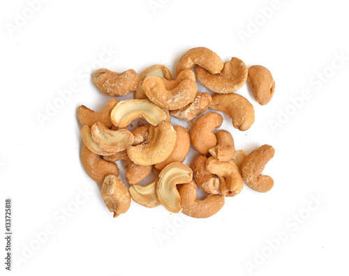 Roasted and salted cashew nut over white background