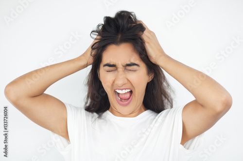 Quadro em tela Stressed Indian Woman Clutching Head and Screaming
