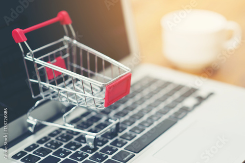 Shopping Cart, labtop pc, on wood background , online shopping concept