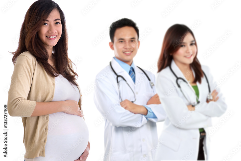 pregnant asian woman standing in front of her doctor pregnant asian woman standing in front of her doctor