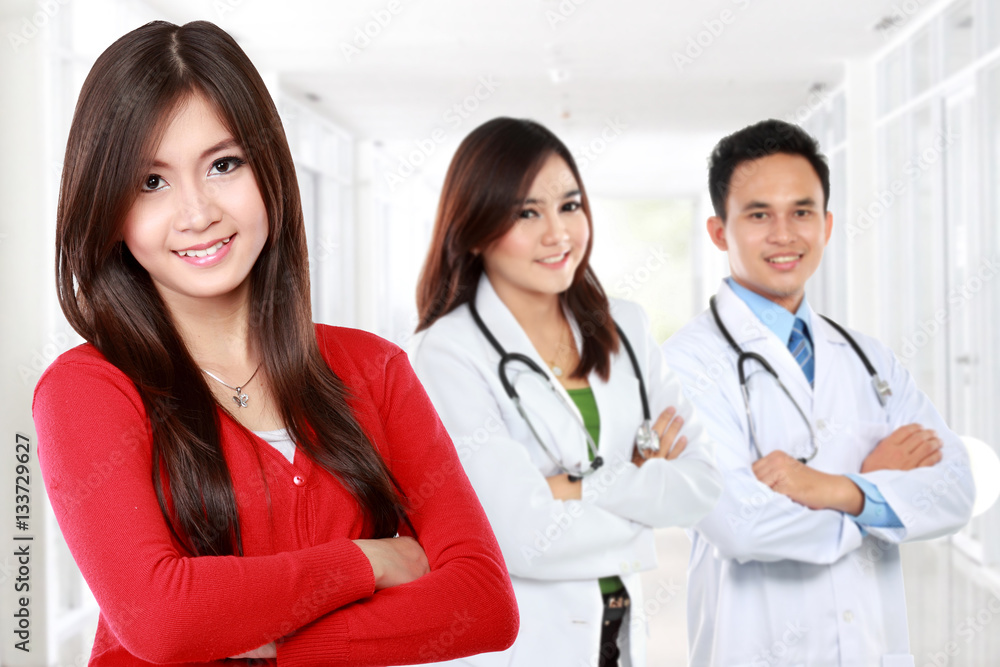 happy patient standing in front of her doctor happy patient standing in front of her doctor