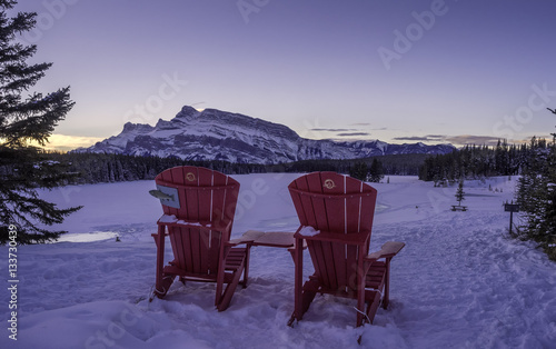 Red Chairs at Two-jack Lake in Banff National Park, Alberta, Canada. Rundle Mountain is in the background.  © Jeff Whyte