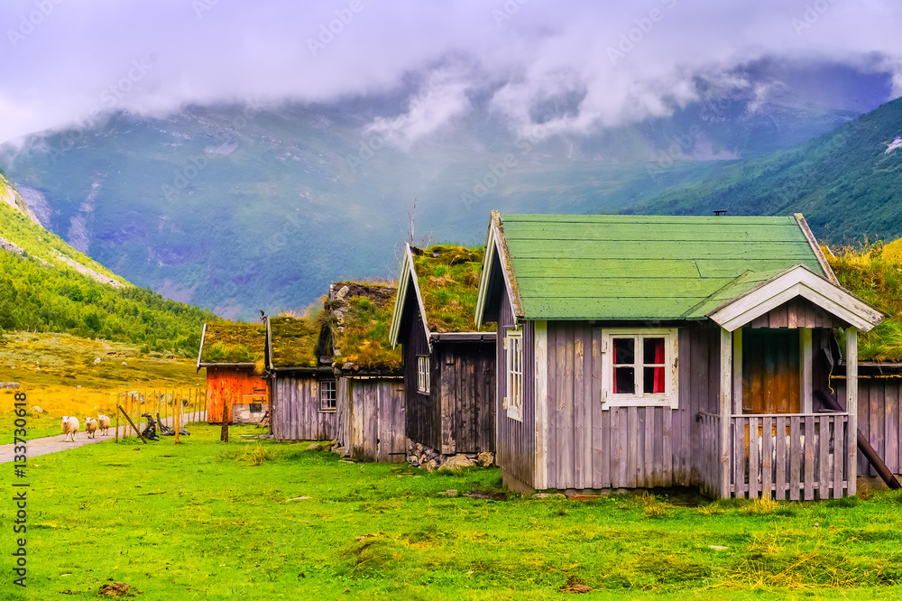 Typical house with grass on the roof in a mountain village. Norway