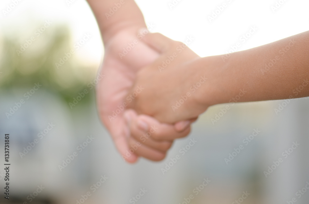 .Two little kids holding hands and holding hands walking. The me .Two little kids holding hands and holding hands walking. The me