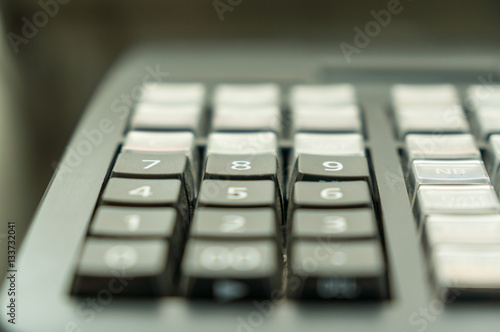 Soft focus Of Cash Register With Printed Receipt