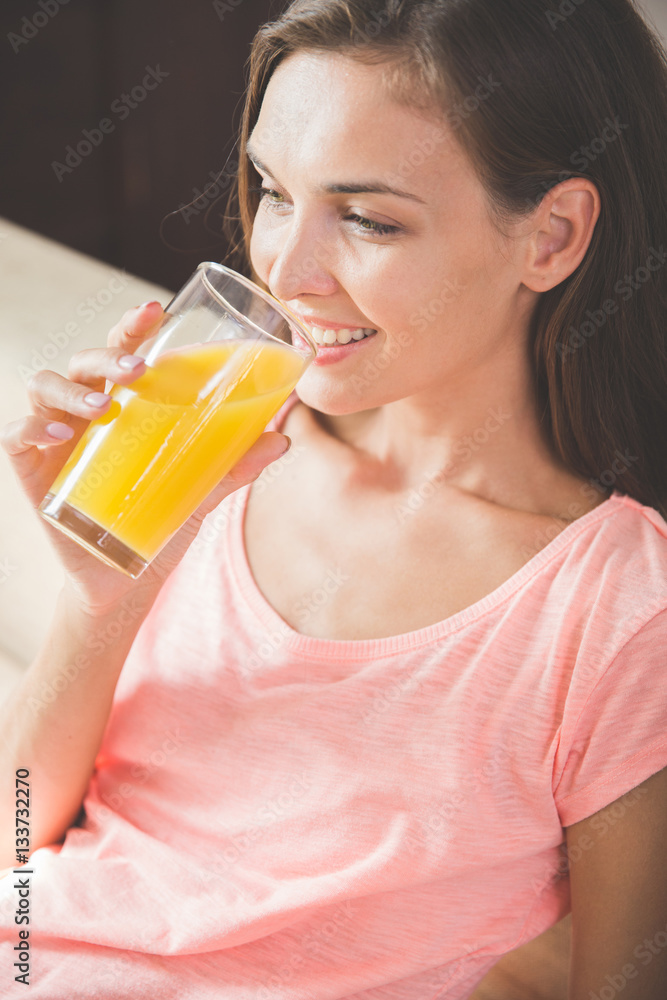 attractive young woman enjoying orange juice attractive young woman enjoying orange juice