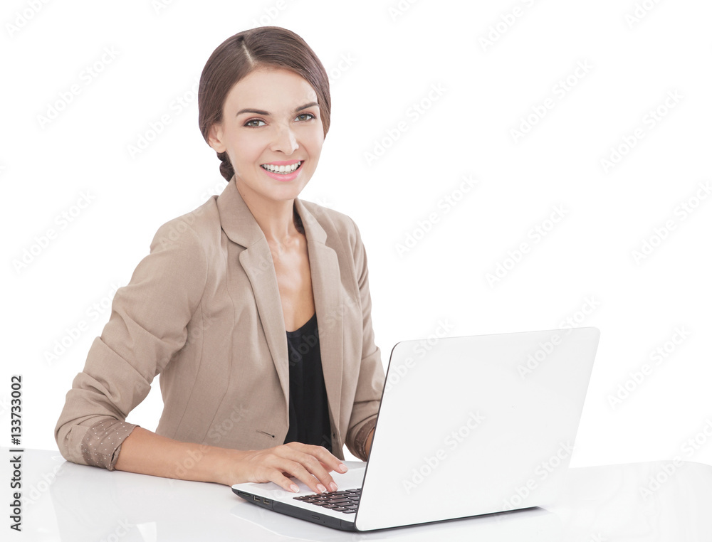 businesswoman smiling while working on her laptop businesswoman smiling while working on her laptop