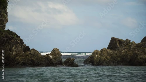 Swimming surfers in open sea with beautiful swell waves. Education surfers in the ocean with big waves. Active sport leisure in Pacific Ocean.Philippines, Puraran,Catanduanes. 4K video. Travel concept photo