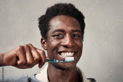 Man with toothbrush.
